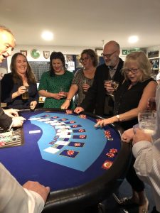 Blackjack dealer entertaining players